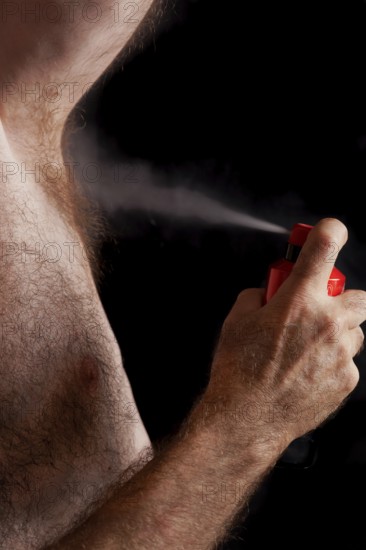 Body care, man with chest hair, spray deodorant