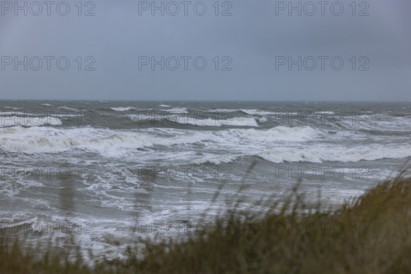 Stormy sea, foaming sea in storm with high waves on the English Channel, Portbail, Cotentin,