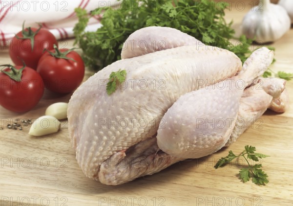 Chicken ready cooked with parsley, tomatoes and garlic
