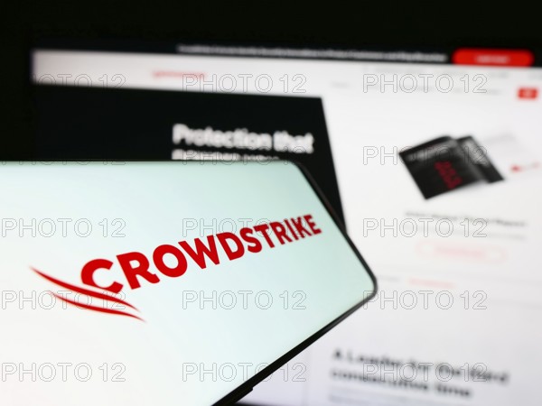 Stuttgart, Germany, 03-31-2023: Smartphone with logo of cybersecurity company CrowdStrike Holdings