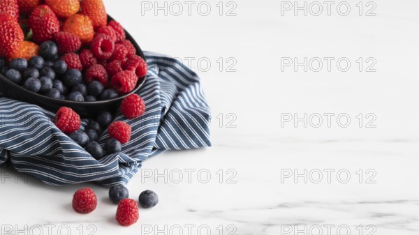 High angle bowl with strawberries raspberries blueberries