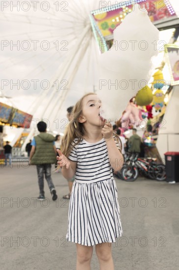 Girl enjoying cotton candy