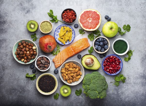 Selection of healthy products and superfoods: salmon, fruit, vegetables, berries, goji, spirulina,