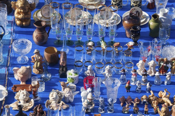 Market stall with porcelain, glasses and figurines at the Bremen flea market Kajenmarkt at