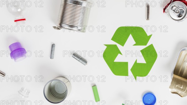 Recycling icon around different litter