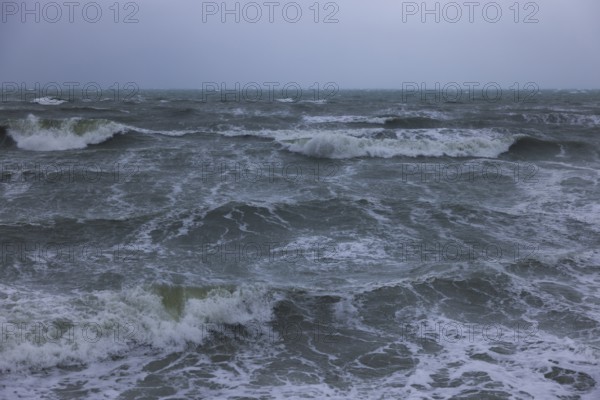 Stormy sea, foaming sea in storm with high waves on the English Channel, Portbail, Cotentin,