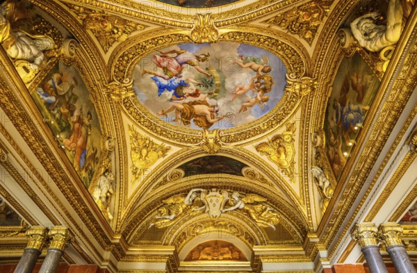 France, April 05 2019. Inside of richly decorated louvre museum. Beautiful ceiling, Europe