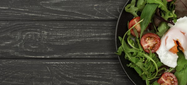 Top view salad with fried egg copy space