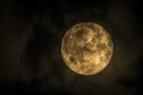 Super moon one day after full moon, moon behind clouds, Braunschweig, Lower Saxony, Germany, Europe