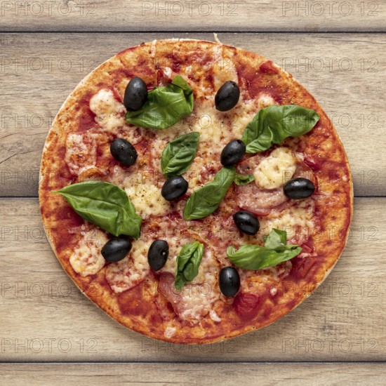 Flat lay arrangement with delicious pizza wooden background