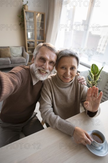 Adorable senior couple taking selfie