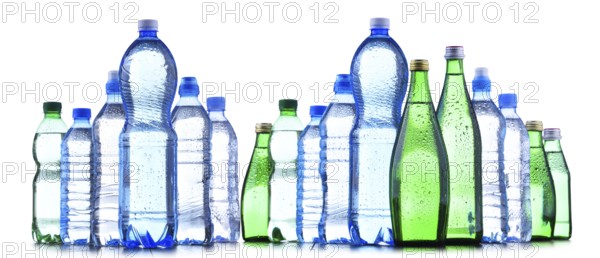 Composition with different sorts of bottles containing mineral water isolated on white