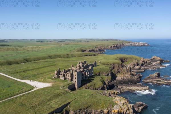 Cruden Bay, United Kingdom - 23 June, 2022: drone view of Slains Castle and the wild coast of