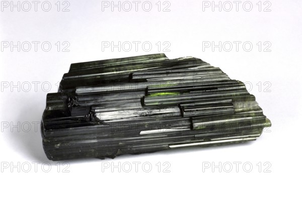 Green tourmaline stone against white background