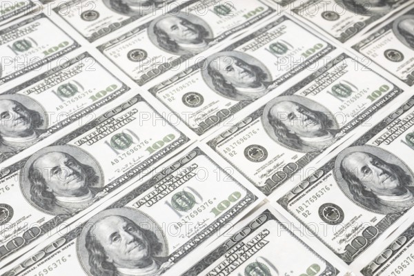 US dollar background. Closeup of a rows of banknotes hundred dollar bills. American currency