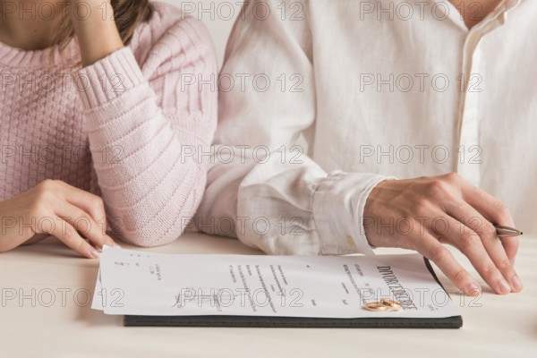 Close up couple with divorce decree