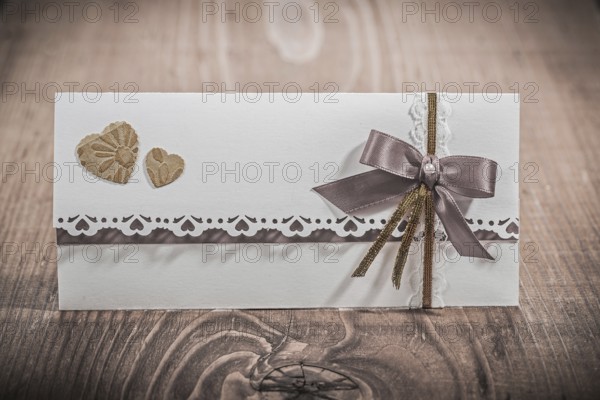 Invitation card for wedding on wood board