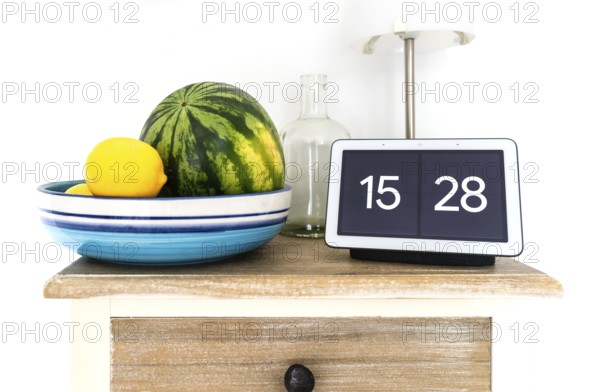 2020-08-31 Hamburg, Germany: Google Nest Hub smart display and smart speaker on kitchen shelf with