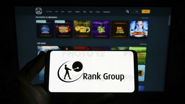 Stuttgart, Germany, 09-15-2022: Person holding smartphone with logo of British gambling company The