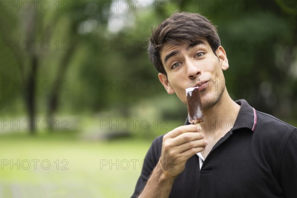 Man enjoying ice cream in the park