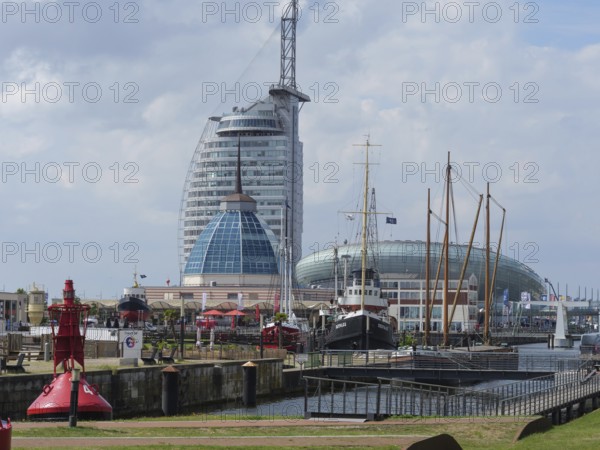 Modern buildings and ships in the harbour, with lighthouse and maritime atmosphere, bremerhaven,
