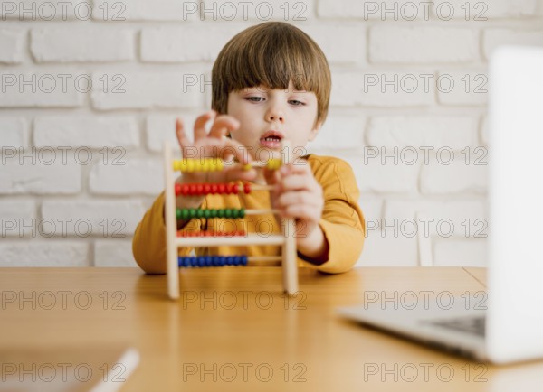 Front view child with abacus desk
