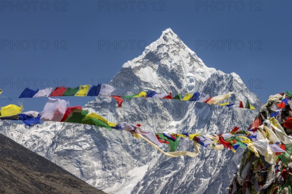Ama Dablam, the well-known mountaineering peak in the Everest Region, seen with Buddhist prayer