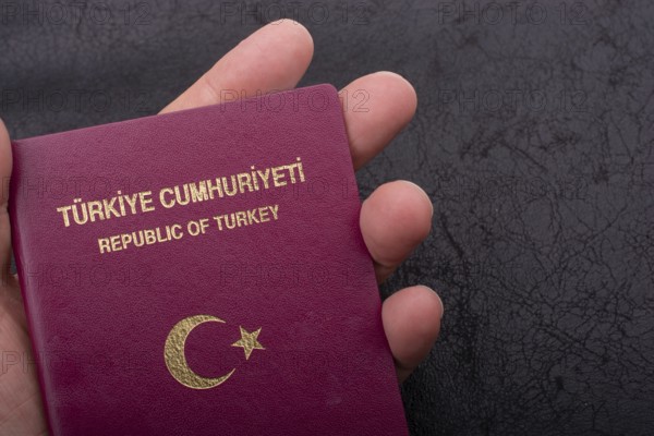 New Turkish passport. Travel, tourism, emigration and passport control concep