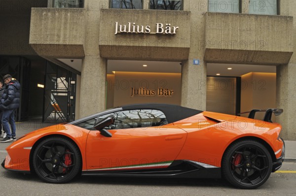 Switzerland: A orange Lamborghini in front of Julius Bär bank at Bahnhofsstrasse in Zurich city