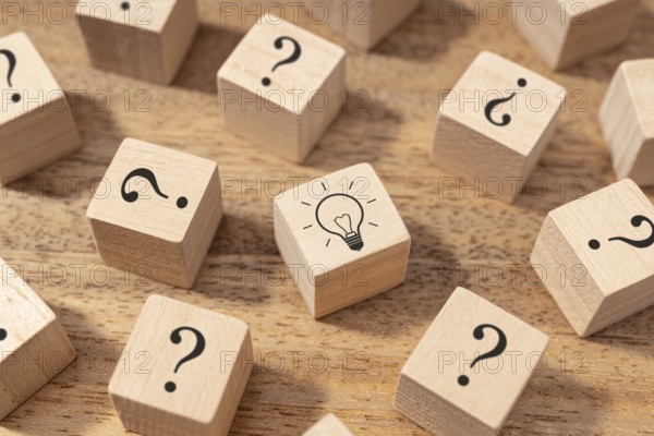 Creative idea and innovation concept. Wooden blocks with question mark symbol and light bulb