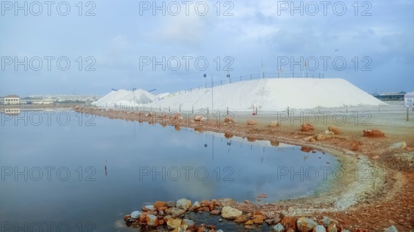 Mountains of sea salt in the Torrevieja salt mining industry in the lagoon, Spain, Europe