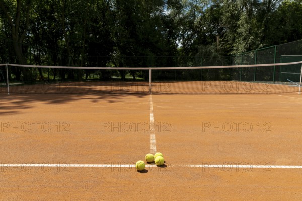 Tennis court with tennis balls ground