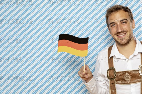 Man holding german flag with copy space