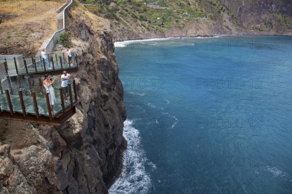 Tourists look at view from Glass bottomed skywalk, Cabo Girao, Funchal, Madeira, Portugal, Europe