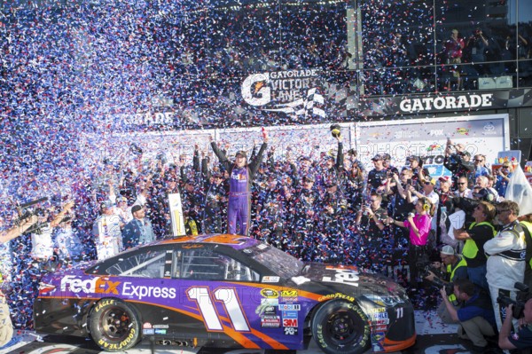 Daytona Beach, FL, Feb 21, 2016: Denny Hamlin celebrates his win in Victory Lane during the Daytona