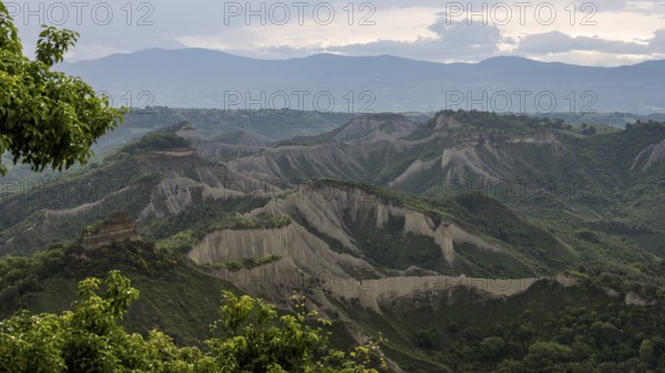 View from Civita di Bagnoregio on hilly landscape Valle dei Calanchi with tuff rocks, Latium,