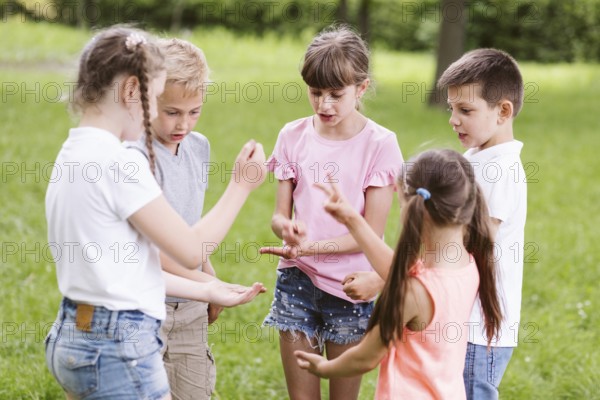 Children playing rock scissors paper