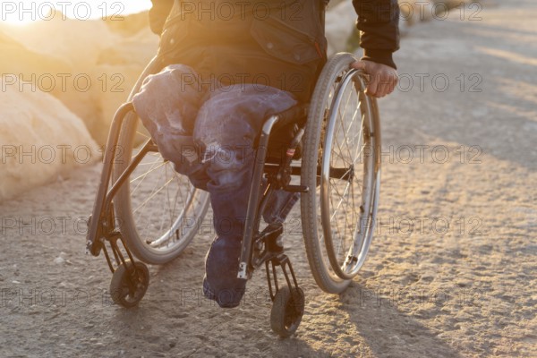 Close up man wheelchair beach