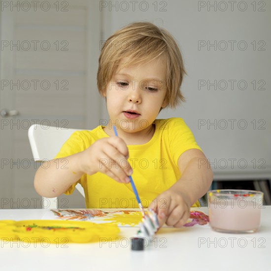Little boy painting