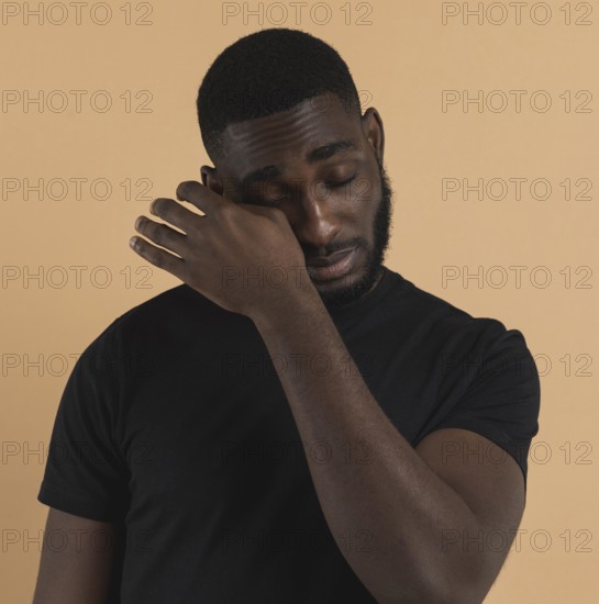 Person wiping away his tears