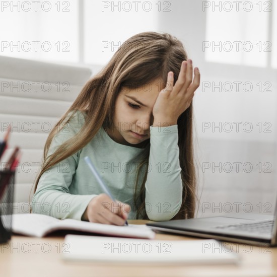 Tired girl taking notes home