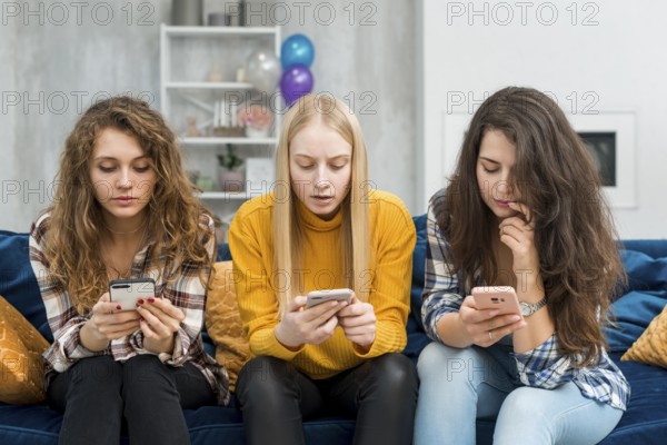 Friends using their smartphones
