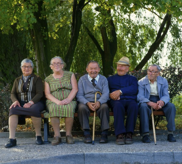 Old people from old people's home on bench