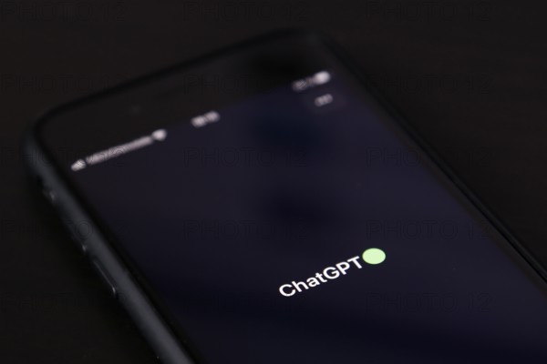 Symbolic image artificial intelligence, detailed view of a smartphone with the app ChatGPT,