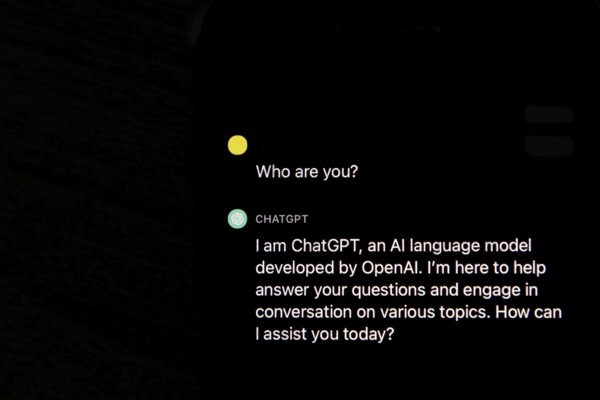 Symbolic image artificial intelligence, detailed view of a smartphone with the app ChatGPT,