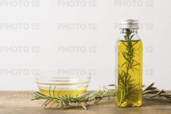 Horizontal shot olive oil with rosemary copy space