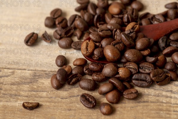Close up roasted coffee beans with spoon