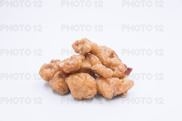 Homemade crispy chicken popcorn white background