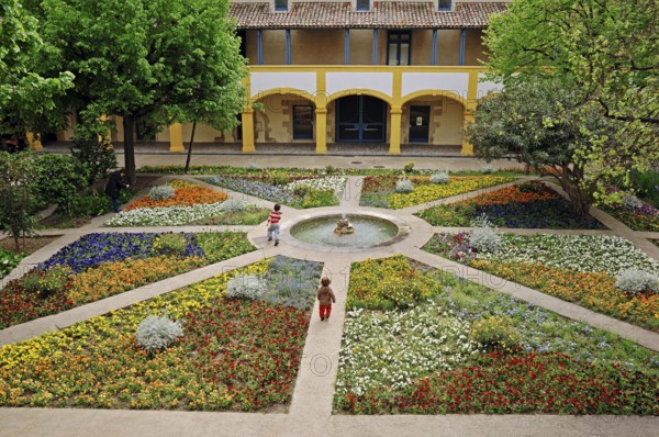 Garden with fountain, Espace Van Gogh cultural centre, former hospital, Arles, Bouches-du-Rhone,