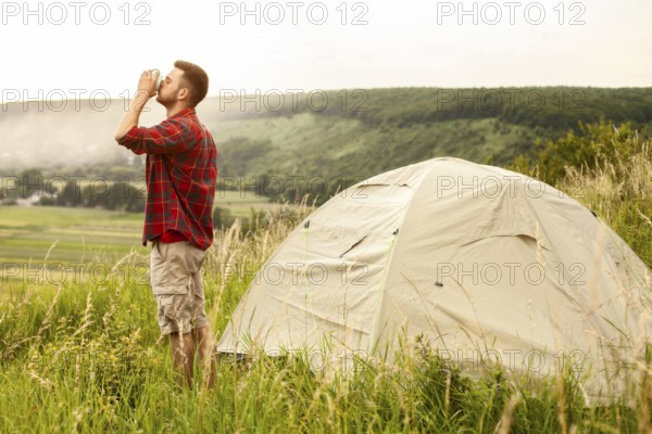 Side view male camping